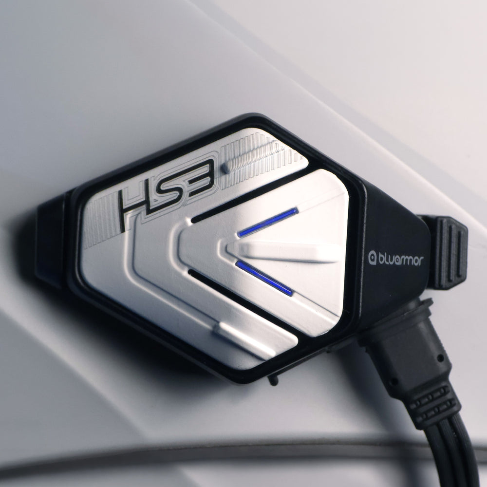 Close-up of BluArmor HS3 silver faceplate with blue indicator lights and attached cable